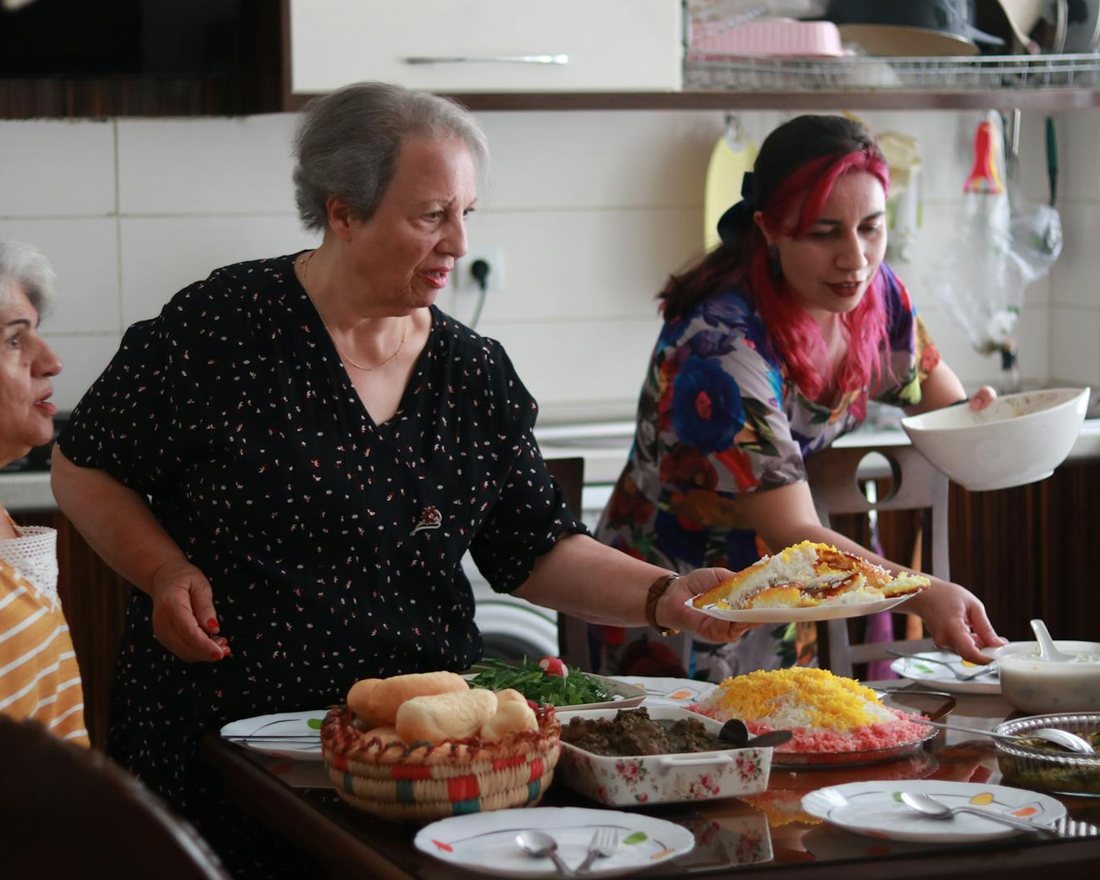 Residents sharing a meal together at a Heartway community